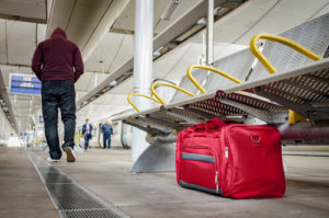 person leaving suspicious bag at airport
